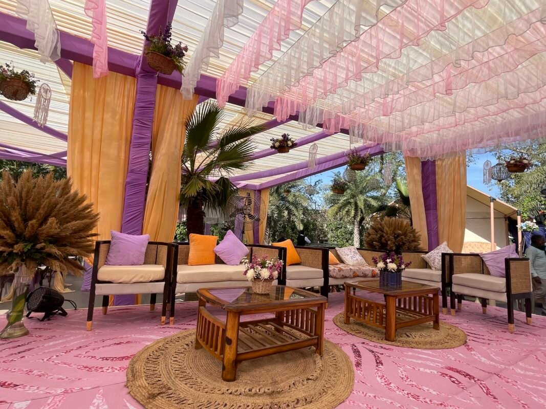 Mehendi Decor setting with considered seating, drapery and floral styling