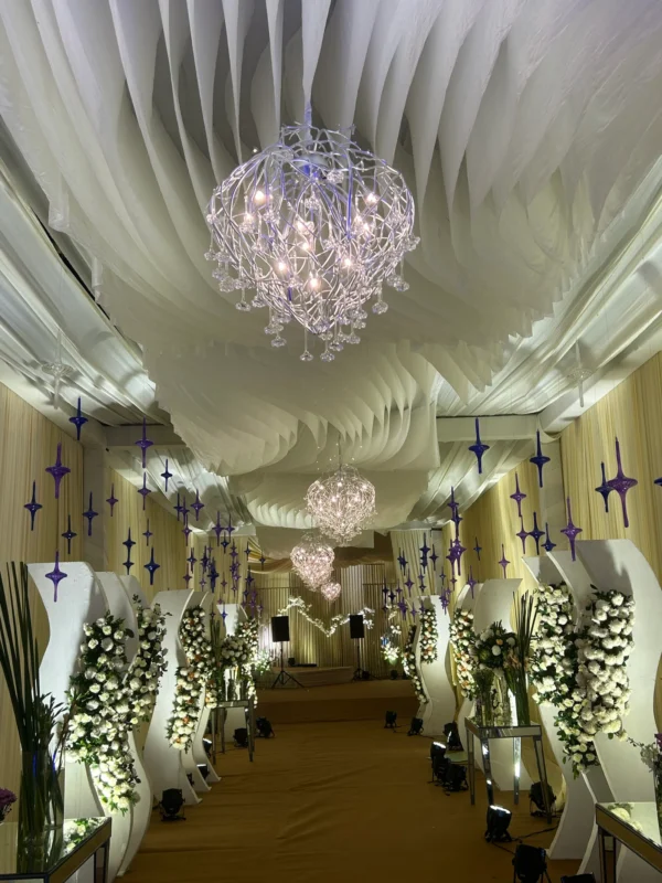 Chandeliers and floral styling in an elegant wedding hall