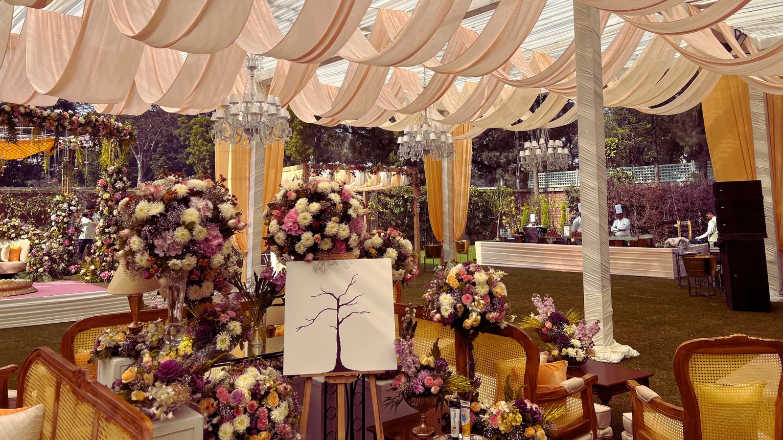 Floral arrangements and softly draped canopies